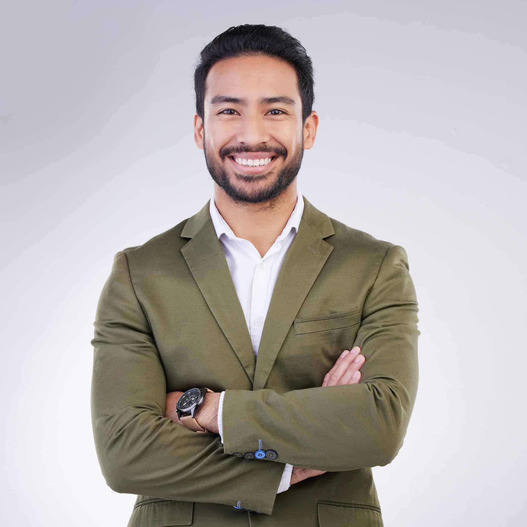 Smile, crossed arms and portrait of business man in studio for success, confidence mindset and lead